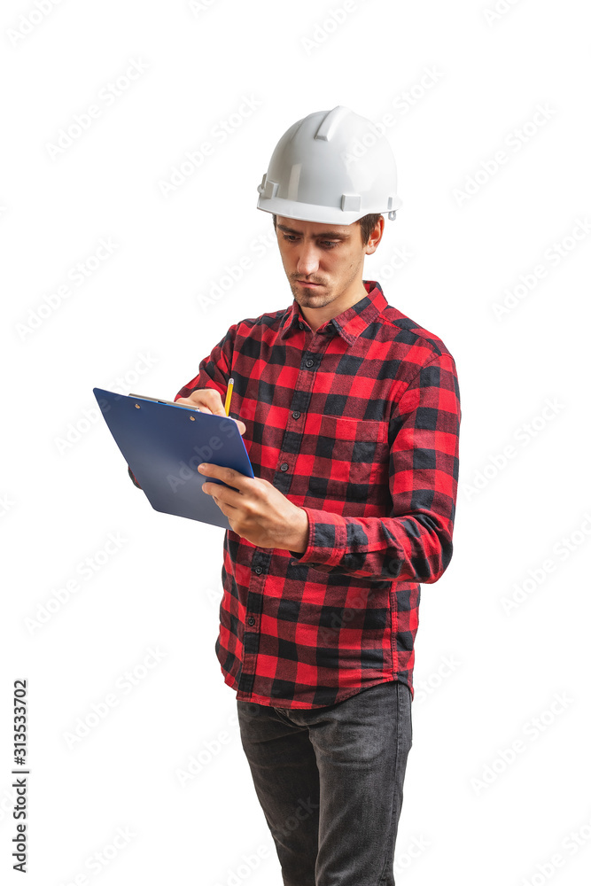 a civil engineer in a white helmet studies documents on an isolated white background . Preparation for finishing a civil engineer in a white helmet studies documents on an isolated white background . Preparation for finishing