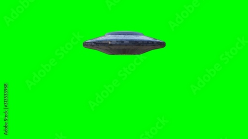 UFO fly by, rotating spaceship with extraterrestrial visitors, alien flying saucer isolated on green screen background, 4k loop 