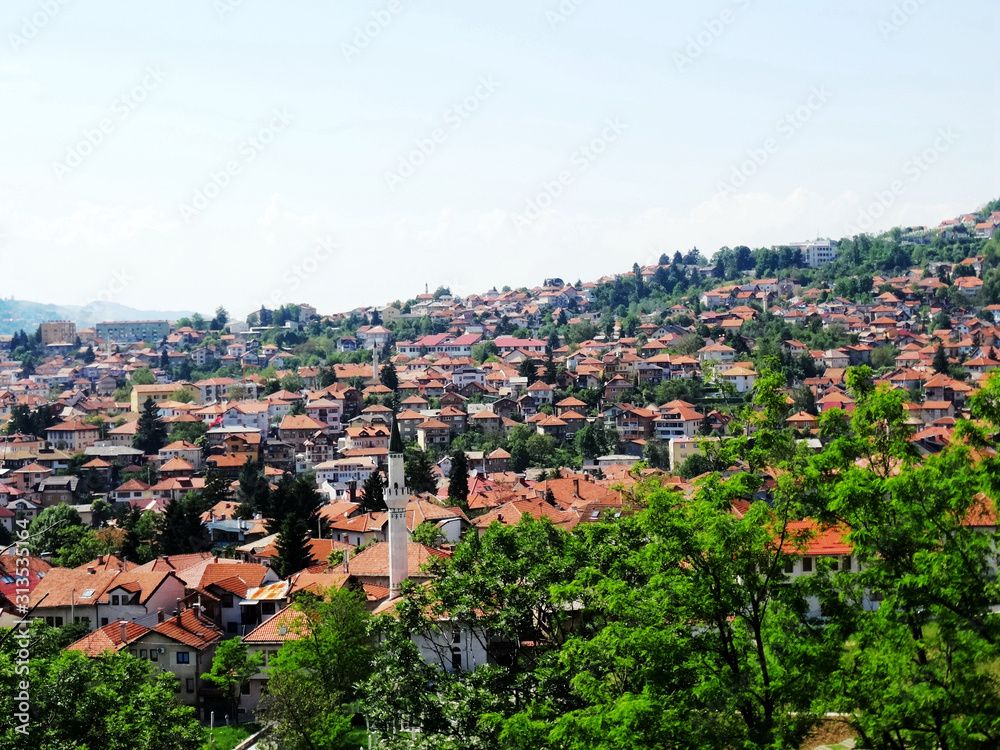 Landscape and countryside of cityscape in Sarajevo besides mountains in summer. Sarajevo is the capital city and the administrative center of Federation of Bosnia and Herzegovina.