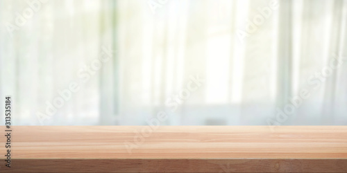 Wood table top with blurred background. 