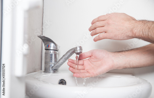Man cleaning hands. Hygiene. Washing hands