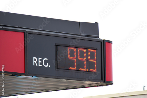 The Top of a Gas Station showing the price of regular gas cost.