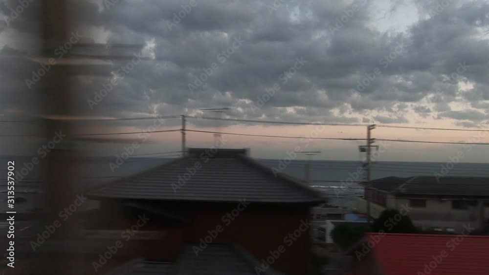 Railway train window. A view of the evening sea Railway train window. A view of the evening sea