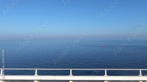 Car window video. Driving on a bridge with a view of the sea