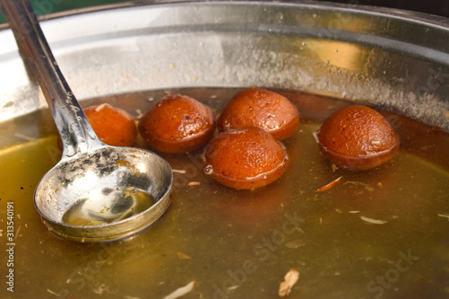 Hot gulab jamun in sugar syrup