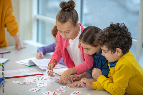 Children learning the alphabet while doing interesting tasks