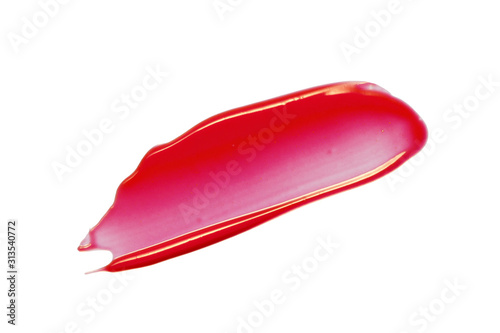 Red pink lip gloss smear smudge. Glossy lipstick swatch isolated on white background. Cosmetic beauty product swipe. Make-up texture