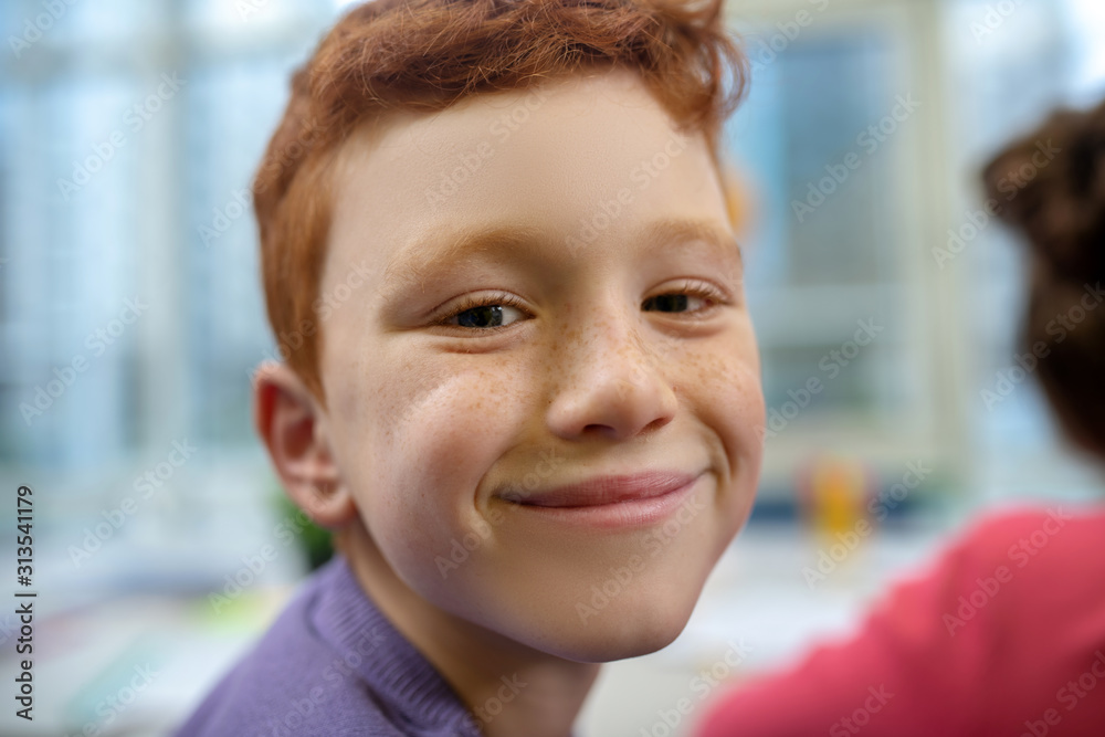 Little boy being happy during his school lesson Little boy being happy during his school lesson