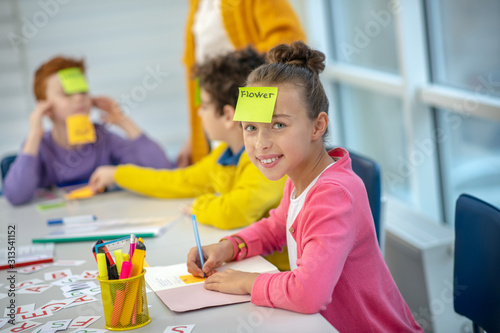 Pupils playing learning vocabulary during the lesson photo