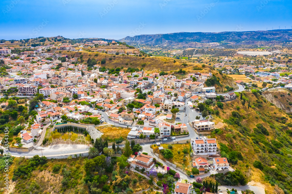 Obraz premium Cyprus. Pissouri village. City on the hills. Streets of the village of Pissouri top view. Pissouri resort with a drone. Travel to cities Cyprus. Single tour to the Republic of Cyprus. Tourist Hotels
