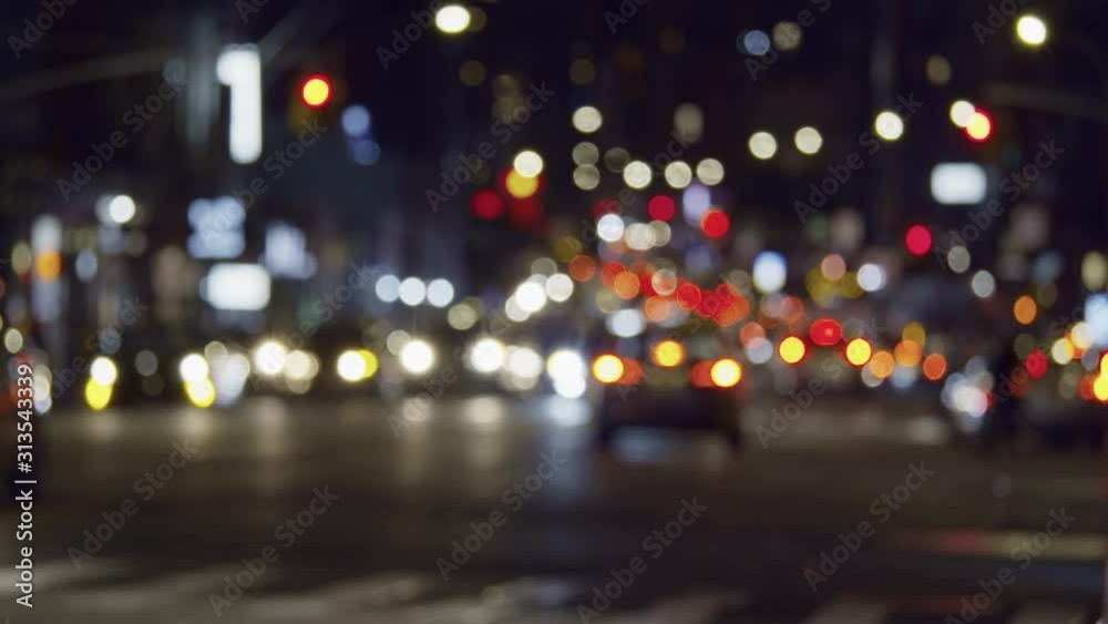 Urban NYC scenery with colorful lights and blurry street traffic, commuting cars at night Urban NYC scenery with colorful lights and blurry street traffic, commuting cars at night