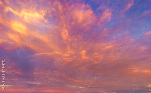 beautifully lit clouds during sunrise © Mike Mareen