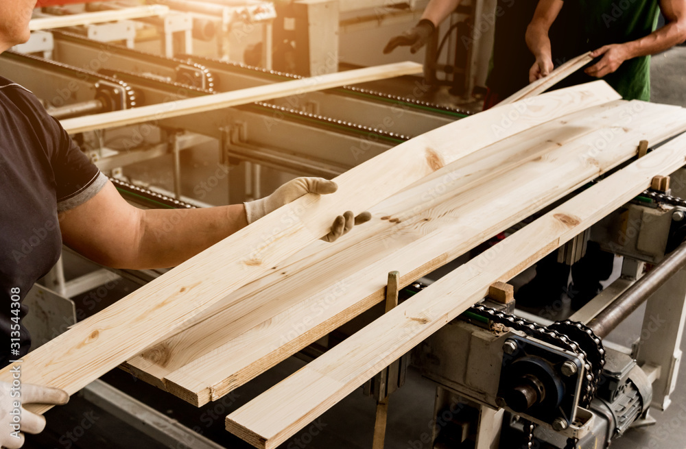 Production line of the wooden floor factory. CNC automatic woodworking machine. Production line of the wooden floor factory. CNC automatic woodworking machine.