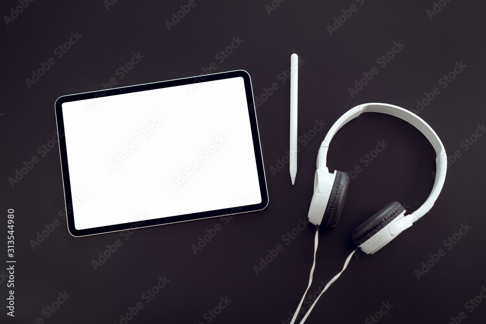 Woman hand hold tablet and digital pen with blank copy space screen for your advertisement. laptop on the table in office. Woman hand hold tablet and digital pen with blank copy space screen for your advertisement. laptop on the table in office.