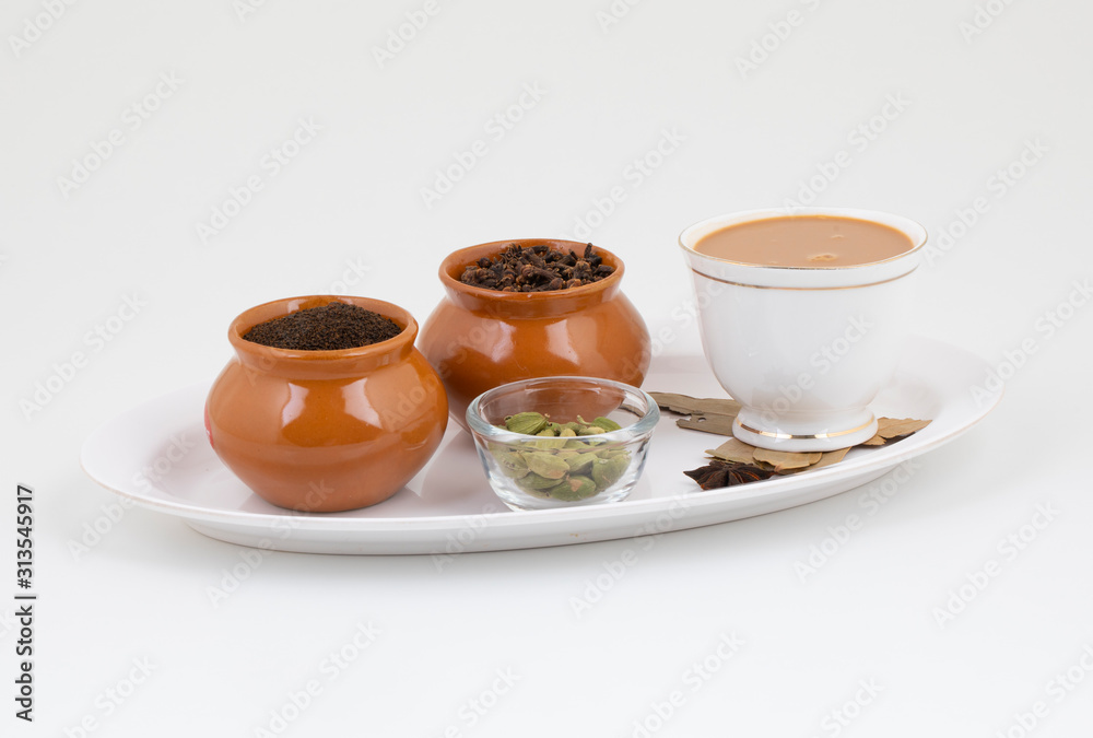 Indian Popular Drink Masala Chai or Masala Tea With Toast on White Background Indian Popular Drink Masala Chai or Masala Tea With Toast on White Background