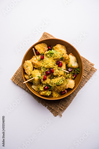 Aloo chaat or Alu chat is a popular street food originating from the Indian subcontinent, especially north India. it's an easy food recipe. photo