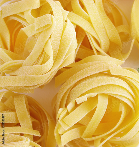 Tagliatelle pasta on a wooden table