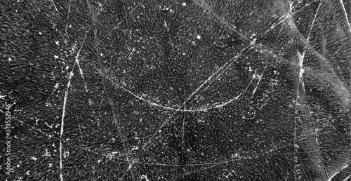 Canvas Print Dunkle Eistextur mit Kratzern von Schlittschuhen