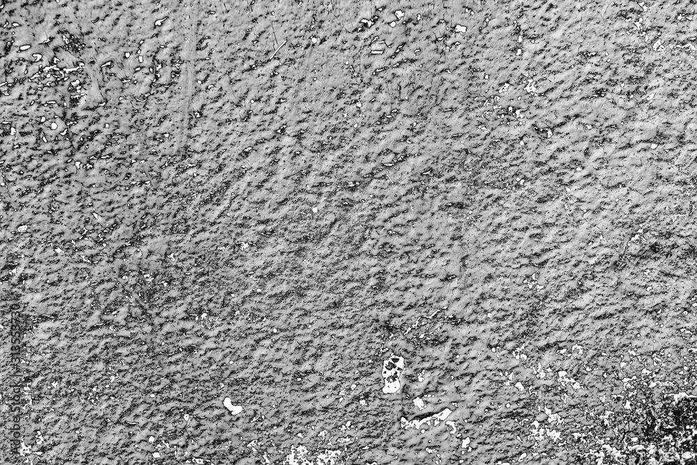 Texture of a concrete wall with cracks and scratches which can be used as a background Texture of a concrete wall with cracks and scratches which can be used as a background