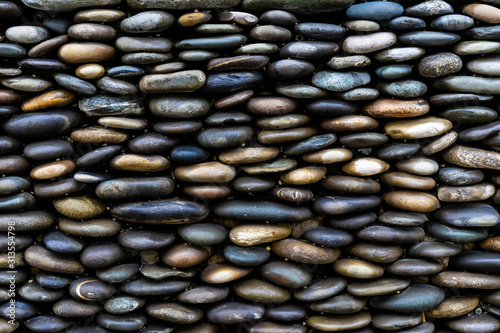 Background of colored sea pebbles side view