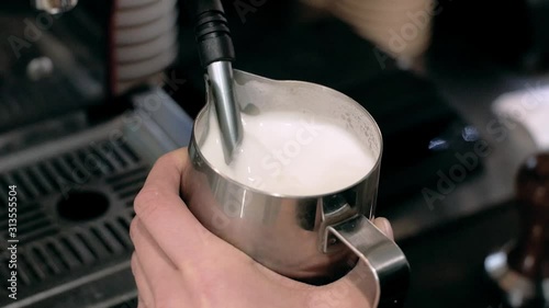 Barista Hands Hold Whisking The Milk Making Cappuccino Drink Servicing An Order In Cafe photo