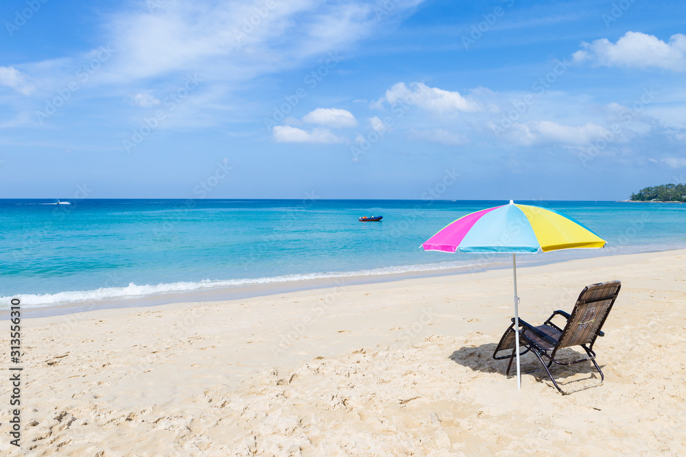 Beautiful beach in Southern Thailand, Relaxing at the beach, summer outdoor day light, Thailand holiday destination, colorful beach umbrella with beach chairs on the beach Beautiful beach in Southern Thailand, Relaxing at the beach, summer outdoor day light, Thailand holiday destination, colorful beach umbrella with beach chairs on the beach