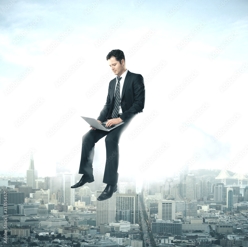 Businessman using laptop sitting on cloud Businessman using laptop sitting on cloud