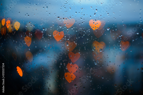 Heart-shaped city lights through window