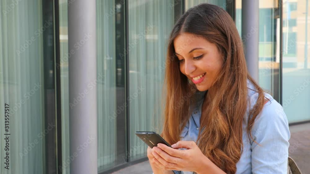 Portrait of a young beautiful business or student woman using smart phone outdoor Portrait of a young beautiful business or student woman using smart phone outdoor