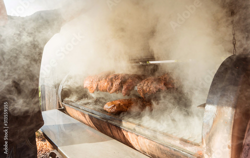 Photos Large barbecue smoker grill at the park