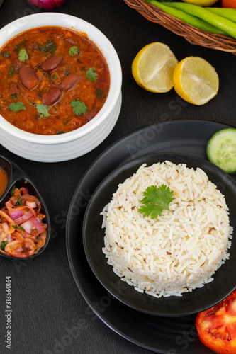Rajma Chawal or Rajma Jeera Chawal  Rice  is a Traditional North Indian Food  Consisting of Cooked Red Kidney Beans in a Thick Gravy with Spices. Served with Jeera Rice