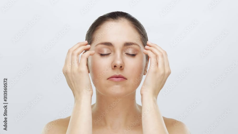 Studio portrait of young, beautiful and natural blond woman applying skin care cream. Face lifting, cosmetics and make-up. Studio portrait of young, beautiful and natural blond woman applying skin care cream. Face lifting, cosmetics and make-up.