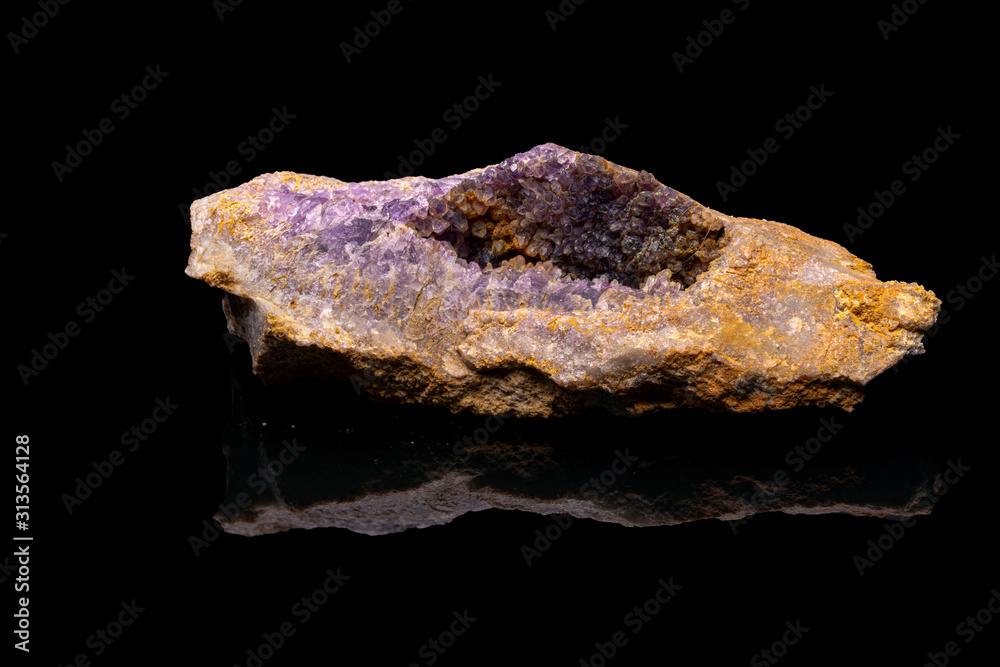 Purple rough Amethyst quartz crystals geode isolated on black Purple rough Amethyst quartz crystals geode isolated on black