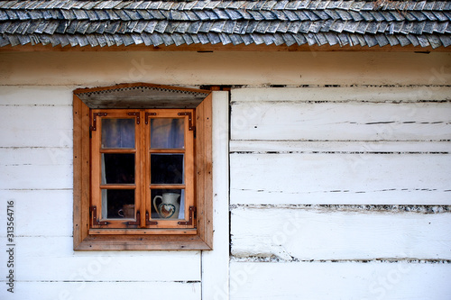 Decorative window in an old wooden house