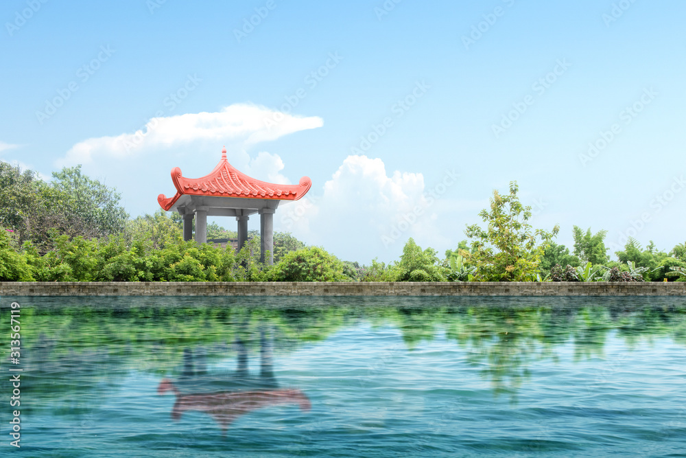 Chinese gazebo building with pond and trees on the park Chinese gazebo building with pond and trees on the park