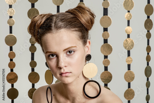 girl with fashion makeup posing in the Studio on a white background with garlands
