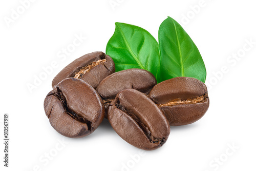 Heap of roasted coffee beans with leaves isolated on white background. photo