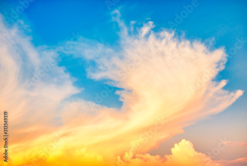 Beautiful cloudscape with blue sky and fluffy clouds at sunset