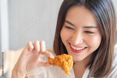 hungry woman looking, eating fried chicken, concept of delicious food, health care, eating habit, yummy fried chicken
