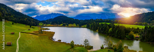 View from flying drone. Astonishing evening view of Wagenbruchsee (Geroldsee) lake with Westliche Karwendelspitze mountain range on background, Bavarian Alps, Germany, Europe. photo