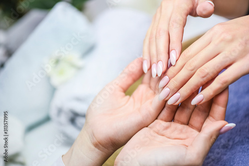 Perfect manicure care. Woman hands care and relaxing. Nails salon