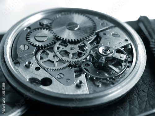 close up macro pic of vintage cronograph wath mechanism