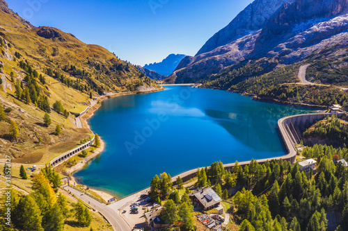 Lago Fedaia (Fedaia Lake), Fassa Valley, Trentino Alto Adige, an artificial lake and a dam near Canazei city, located at the foot of Marmolada massif. Fedaia Lake is the Province of Belluno, Italy. photo