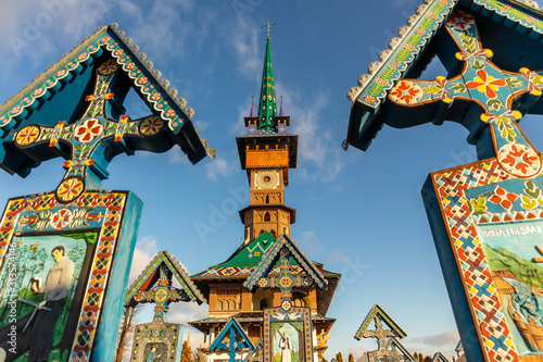 Colorful, painted wooden crosses at Merry Cemetery of Sapanta. Tombstone vivid colors pictures. Paintings on the wooden crosses