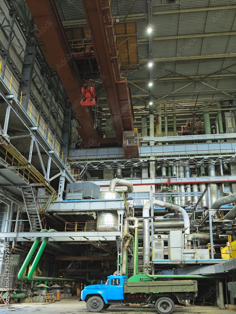 Industrial big water pumps with electric motors, pipes, tubes, equipment and steam turbine at power plant Industrial big water pumps with electric motors, pipes, tubes, equipment and steam turbine at power plant