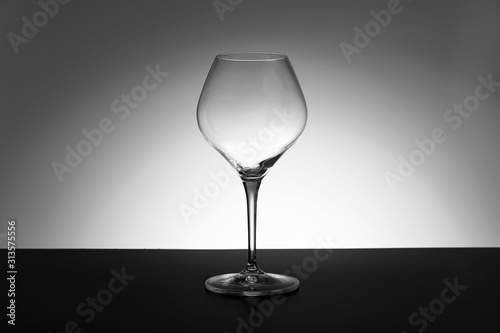 empty wineglass on black and white  background