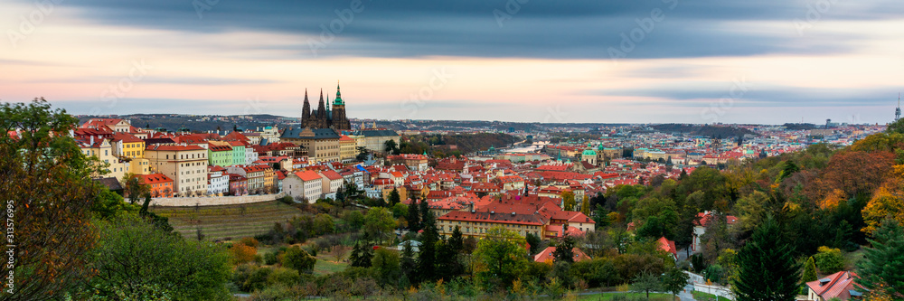 Prague autumn landscape. Prague autumn landscape view to Saint Vitus cathedral. Prague. Prague panorama. Prague, Czech Republic. Scenic autumn aerial view of the Old Town with red foliage. Czechia.