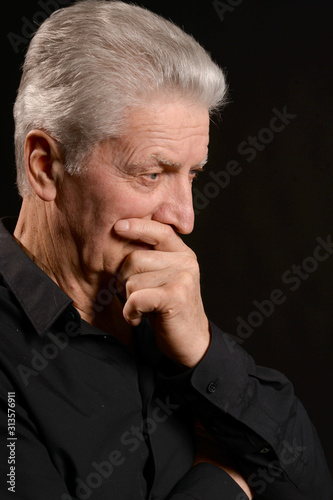 Close up portrait of thoughtful senior man