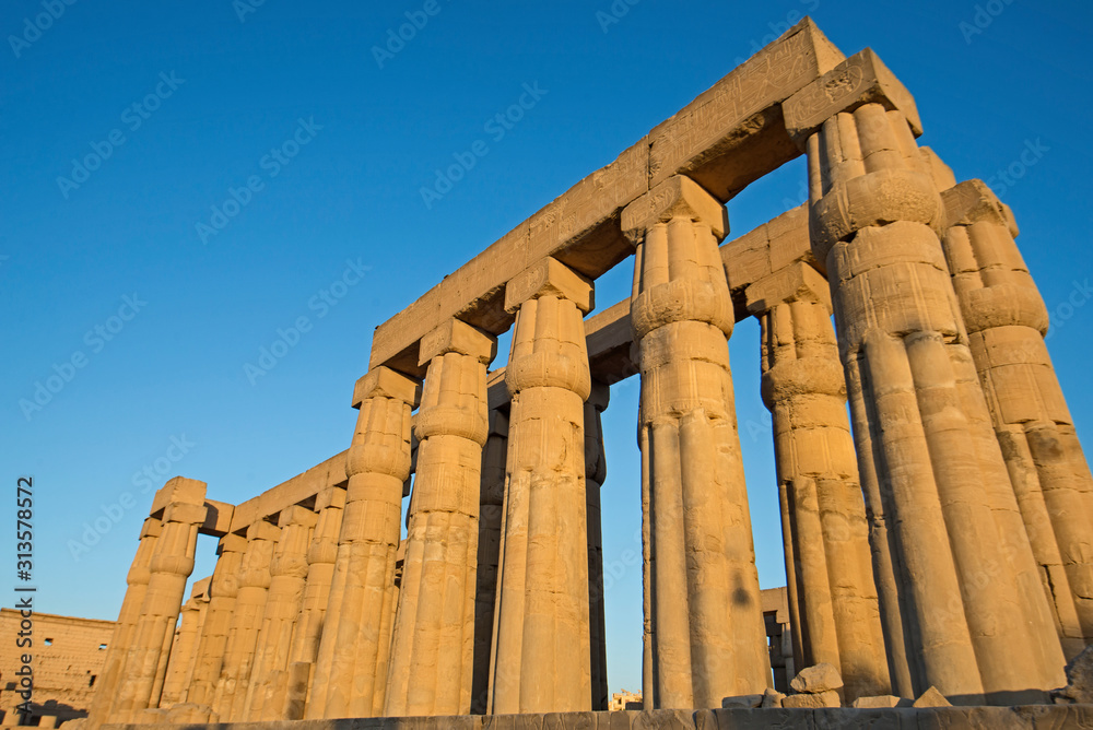 Ancient egyptian hieroglyphic carvings on columns in temple Ancient egyptian hieroglyphic carvings on columns in temple