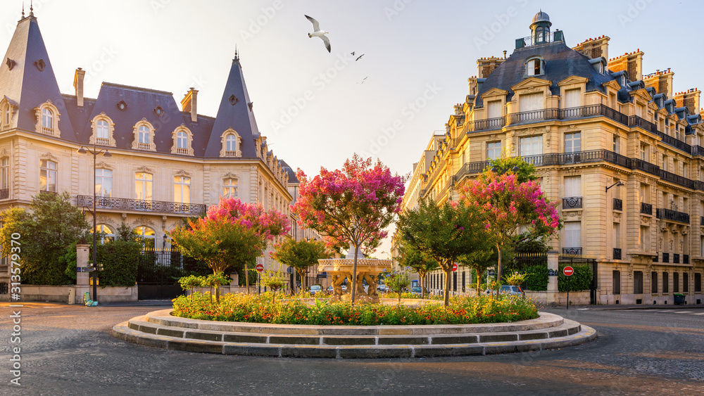 Typical view of the Parisian street in Paris, France. Architecture and landmark of Paris. Beautiful view of the street with flowers and architecture in Paris, France.